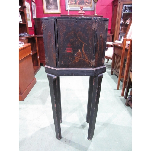 4007 - A Chinoiserie lacquered cabinet on stand with gilt figural and bird embellishment, three doors openi... 