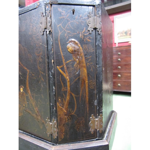 4007 - A Chinoiserie lacquered cabinet on stand with gilt figural and bird embellishment, three doors openi... 
