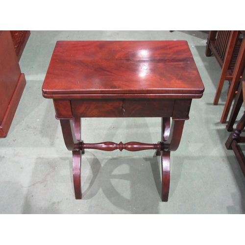 4055 - A 19th Century mahogany games/work table the hinged fold-over swivel top and baize playing surface o... 