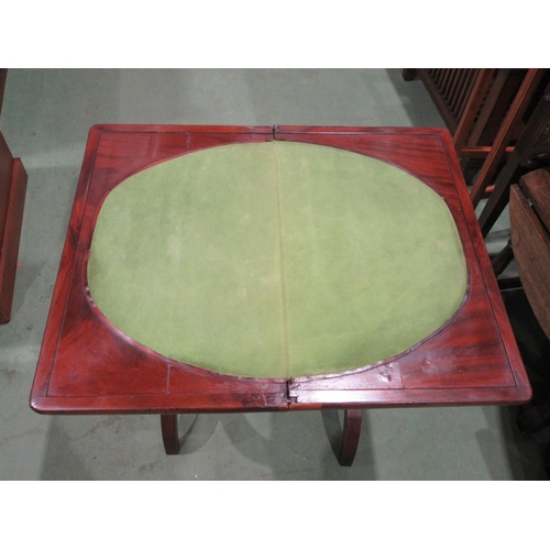 4055 - A 19th Century mahogany games/work table the hinged fold-over swivel top and baize playing surface o... 