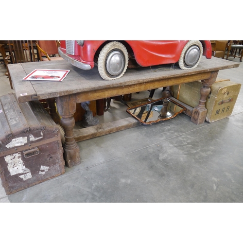 2002 - A weathered oak refectory table 230 x 85cm