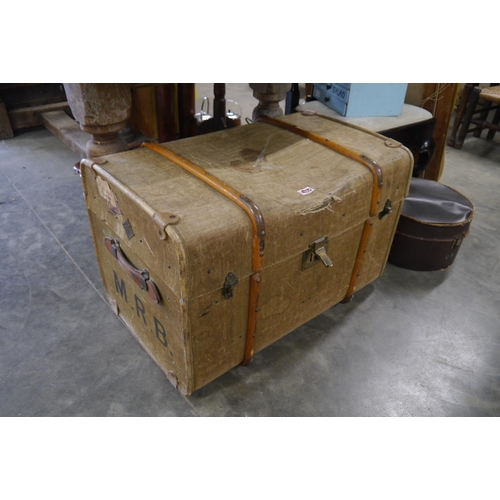 2004 - A Victorian green canvas, beech bound trunk with brass locks and leather handles a/f