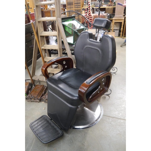 2028 - A chrome based height adjustable leatherette barbers chair