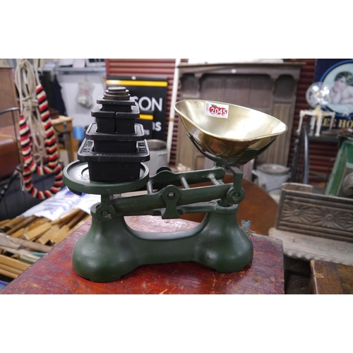 2045 - A Victor cast iron and brass set of scales and a set of weights