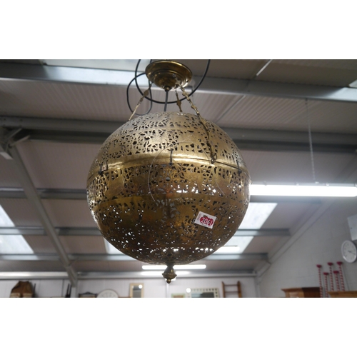 2061 - A pierced brass lantern with wrought iron bracket