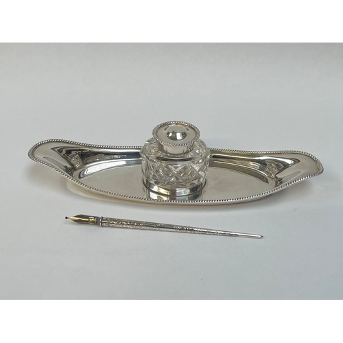 5060 - A William Hutton & Sons Ltd silver desk ink stand, oval boat form with gadrooned border, with origin... 