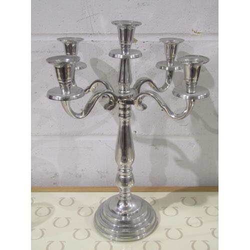 1033 - A plated four arm five sconce candelabrum, approximately 40cm tall
