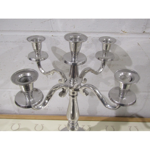 1033 - A plated four arm five sconce candelabrum, approximately 40cm tall