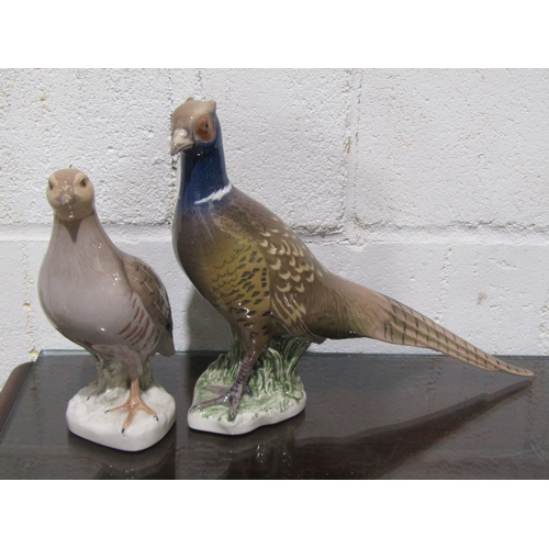 1051 - Four Royal Copenhagen bird figures, to include Partridge model No.2261, another, Pheasant and Sparro... 