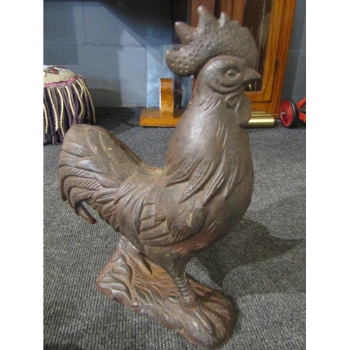 1102 - A cast iron cockerel (32cm height) and a cast iron flying pig moneybox (18.5cm length) (2)