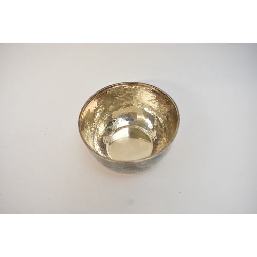 5063 - An Atkin Brother silver hammered bowl and spoon monogrammed M.R.A., Sheffield 1925, 1920.  The bowl ... 