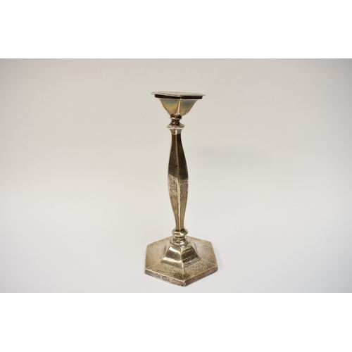 5024 - A silver candlestick with hexagonal top and base, Birmingham 1919, 23cm tall, weighted base dented