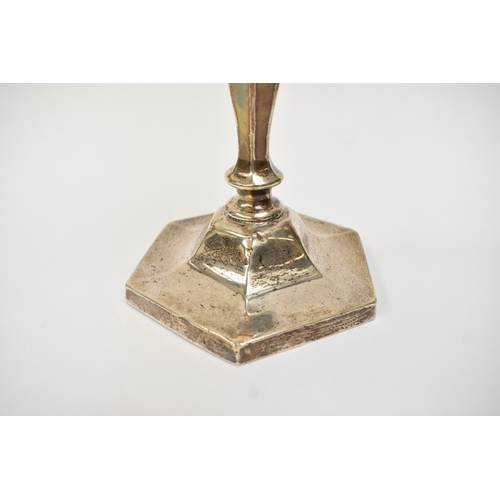 5024 - A silver candlestick with hexagonal top and base, Birmingham 1919, 23cm tall, weighted base dented