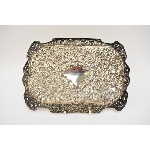 5002 - A Henry Matthews silver pierced tray with all-over embossed decoration of leaves, flowers scrolls, t... 