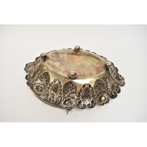 5007 - A silver swing handled basket with pierced panels, floral and shell decoration, raised on four ball ... 