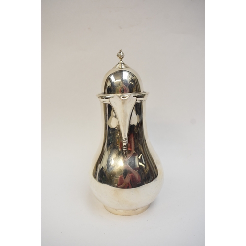 5021 - An Edwardian silver lidded jug of baluster form, with light wood handle. London 1908. By Lambert & C... 