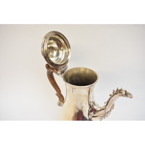 5004 - A George III silver coffee pot of baluster form, with hinged lid, finely-cast rims, foliate-sheathed... 