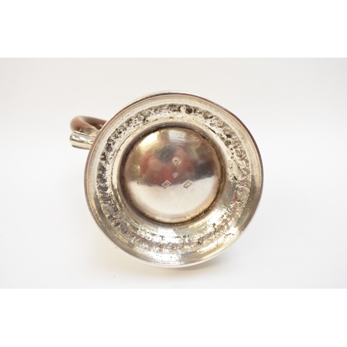 5004 - A George III silver coffee pot of baluster form, with hinged lid, finely-cast rims, foliate-sheathed... 