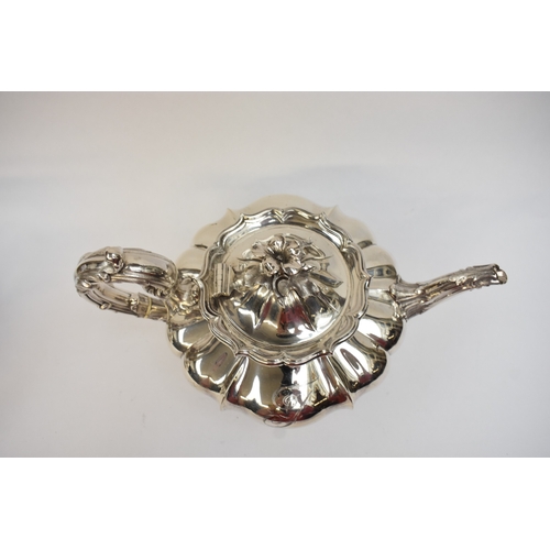 5023 - An early Victorian silver three-piece tea set, comprising a teapot of lobed gourd form, with foliate... 