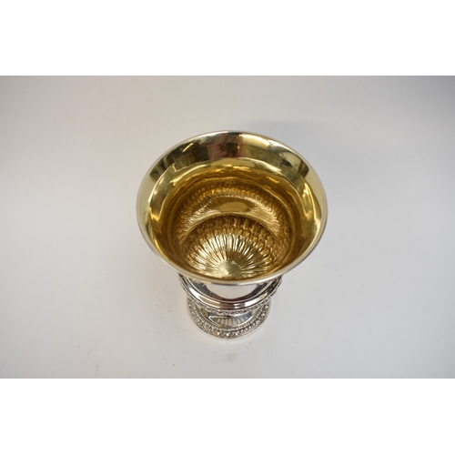 5026 - A late George III silver pedestal cup, the semi-fluted waisted cylindrical bowl applied with a finel... 