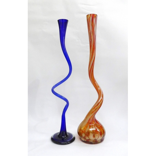 4030 - Two Continental glass 'corkscrew' stem vases, one in blue, one red and caramel mottled colours. Tall... 