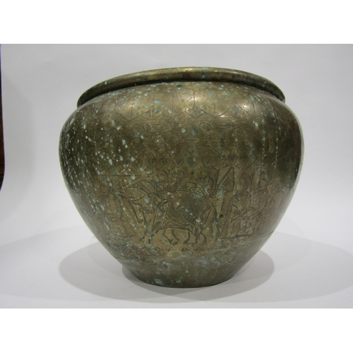 4005 - An Eastern brass jardiniere with embossed design, 30cm diameter, 22cm tall
