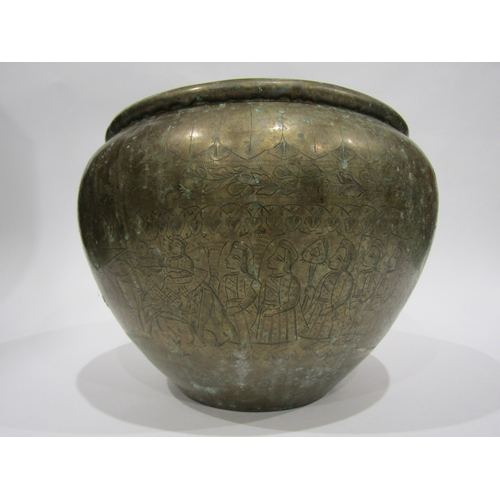 4005 - An Eastern brass jardiniere with embossed design, 30cm diameter, 22cm tall