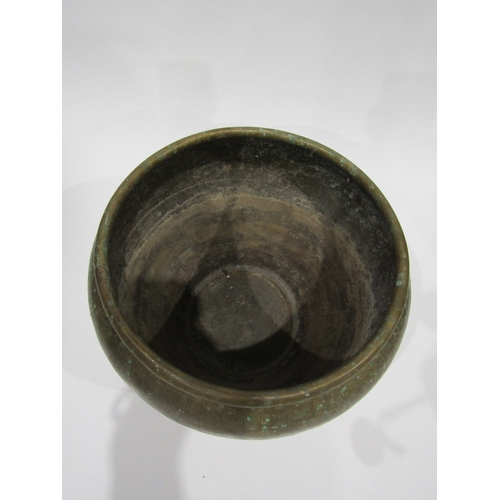 4005 - An Eastern brass jardiniere with embossed design, 30cm diameter, 22cm tall