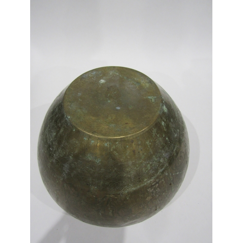4005 - An Eastern brass jardiniere with embossed design, 30cm diameter, 22cm tall
