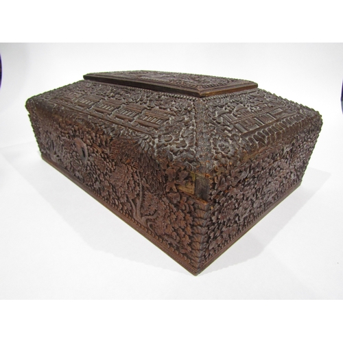 4011 - A late 19th/early 20th Century Chinese carved wooden jewellery box, flora/fauna carving with buildin... 