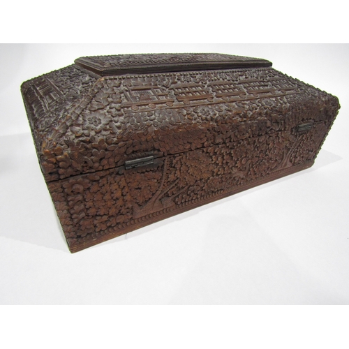 4011 - A late 19th/early 20th Century Chinese carved wooden jewellery box, flora/fauna carving with buildin... 