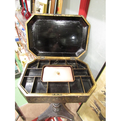 4012 - A chinoiserie lacquered work table on turned column and tripod paw feet, gilt decoration with extern... 