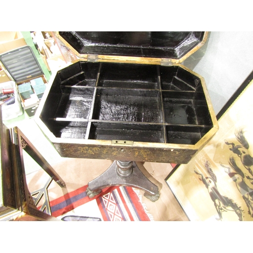 4012 - A chinoiserie lacquered work table on turned column and tripod paw feet, gilt decoration with extern... 