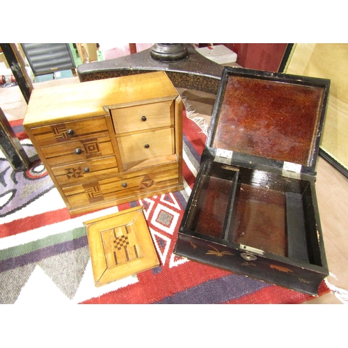 4013 - A Japanese lacquered box in the form of a book, waterside village scene to lid, together with an inl... 