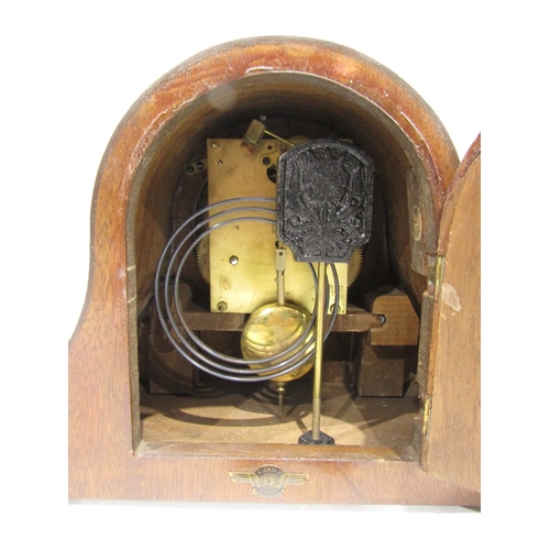 4037 - A Napoleon hat mantel clock with key