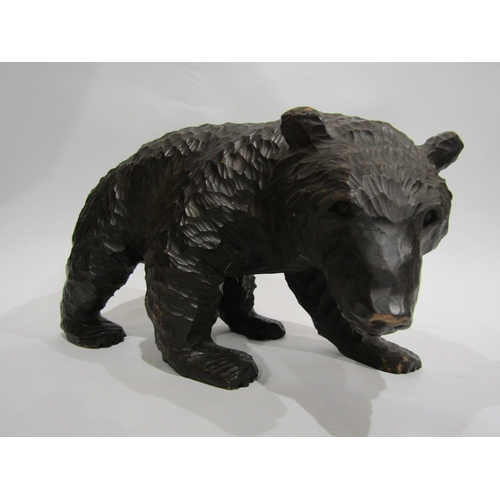 4053 - A carved Black Forest bear, 17cm tall x 30cm long approximately