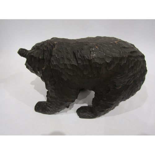 4053 - A carved Black Forest bear, 17cm tall x 30cm long approximately