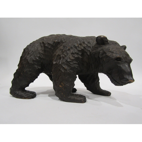 4053 - A carved Black Forest bear, 17cm tall x 30cm long approximately