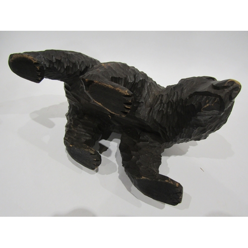 4053 - A carved Black Forest bear, 17cm tall x 30cm long approximately