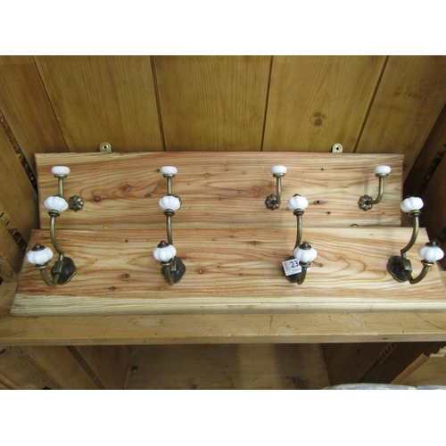 A pair of pine coat racks