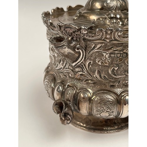 5005 - A Victorian Wakely & Wheeler silver bachelor's three piece tea set with embossed floral, leaf and sc... 