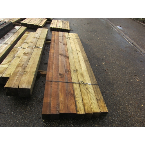Eight 10' x 4" x 4" pressure treated fence posts