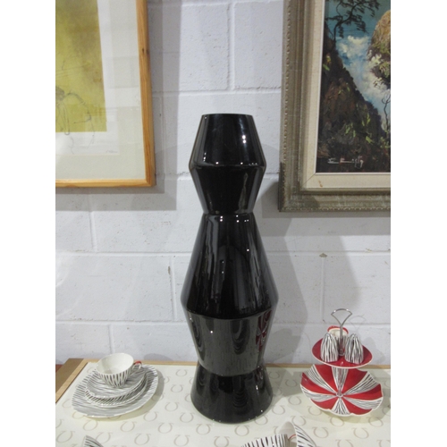 1022 - A modern deep red tall vase, 75cm tall