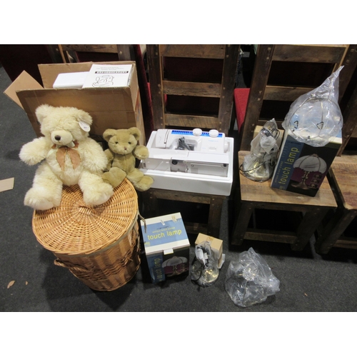 1026 - A wicker laundry basket, two teddy bears, two boxed table lamps and a boxed electric sewing machine