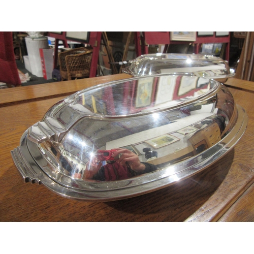 1028 - Two Art Deco form H.B. & H. silver plated serving dishes with covers