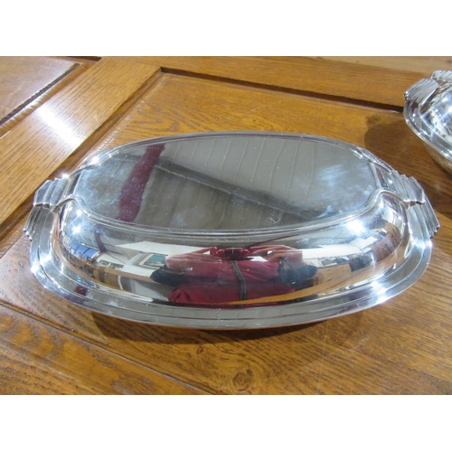 1028 - Two Art Deco form H.B. & H. silver plated serving dishes with covers