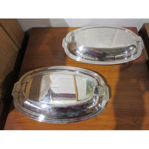 1028 - Two Art Deco form H.B. & H. silver plated serving dishes with covers