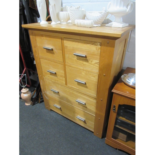 1032 - A Halo Living modern oak four drawer over two long drawer chest, 120cm tall x 100cm wide x 48cm deep