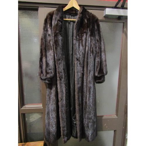 1038 - PELZ GUZIK - a dark brown mink full length fur coat with full sleeve and deep cuff