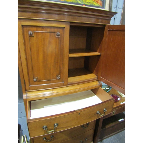 1050 - A reproduction walnut two door cabinet over four drawer bow front chest on bracket feet, 170cm tall ... 
